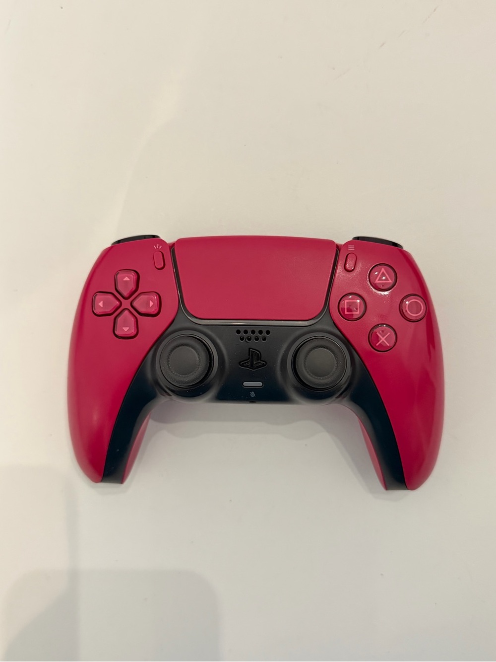 Sony PlayStation 5 DualSense wireless controller in Cosmic Red.